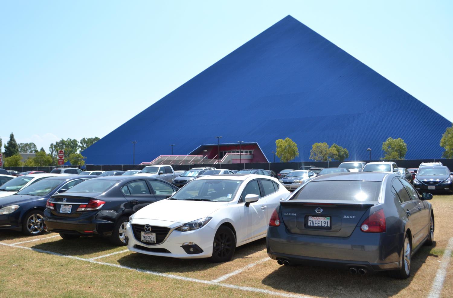 Cars parked at the overflow parking lot in front of the Walter Pyramid Thursday, Aug. 31.