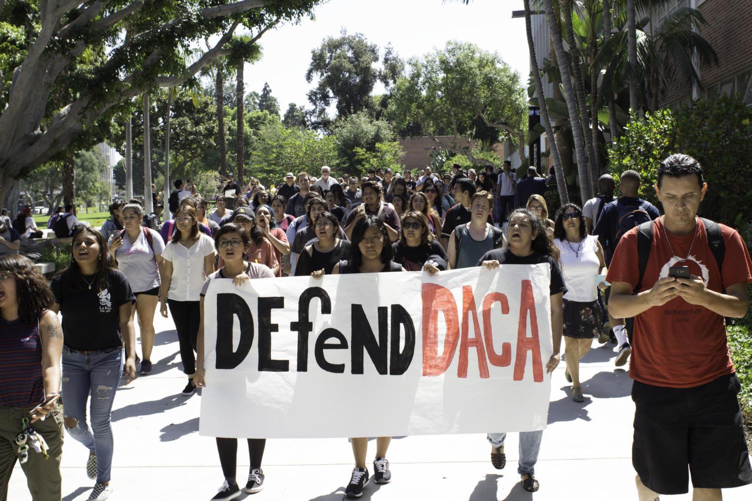 CSULB students and faculty alike protest on Sept. 5 against President Trump’s recent ruling of DACA on Tuesday near the FO3 building.