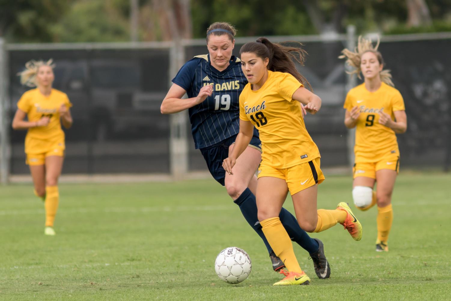 Long Beach State sophomore Katie Pingel dribbles the ball in Sunday's season finale match against UC Davis at George Allen Field.