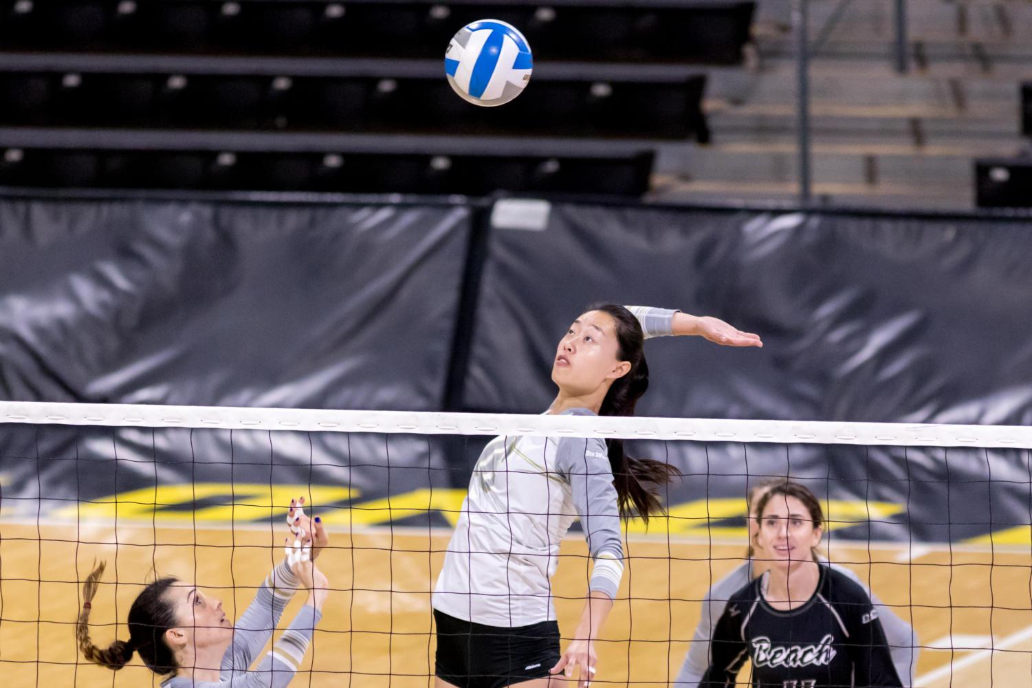 Long Beach State sophomore middle blocker YiZhi Xue spikes the ball in Friday's match against UC Davis at the Walter Pyramid.