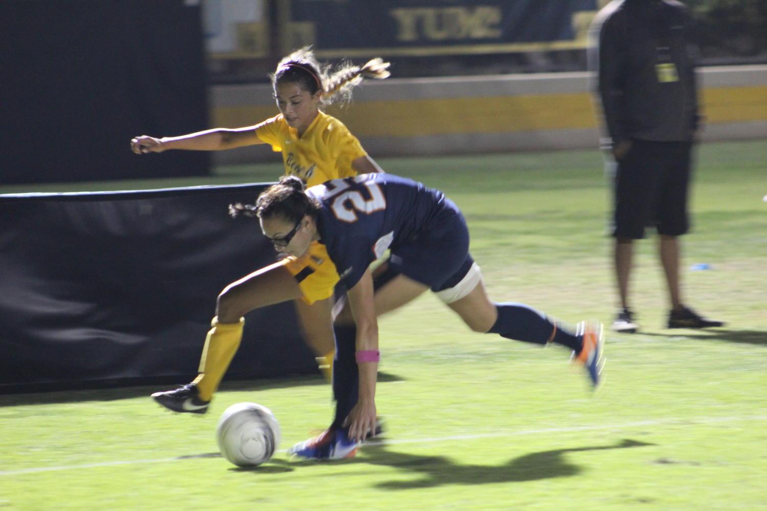 Sophomore Ayana Robles dribbles the ball past Cal State Fullerton’s redshirt senior Jazzmin Mancilla in Sunday’s 2-0 loss at George Allen Field.