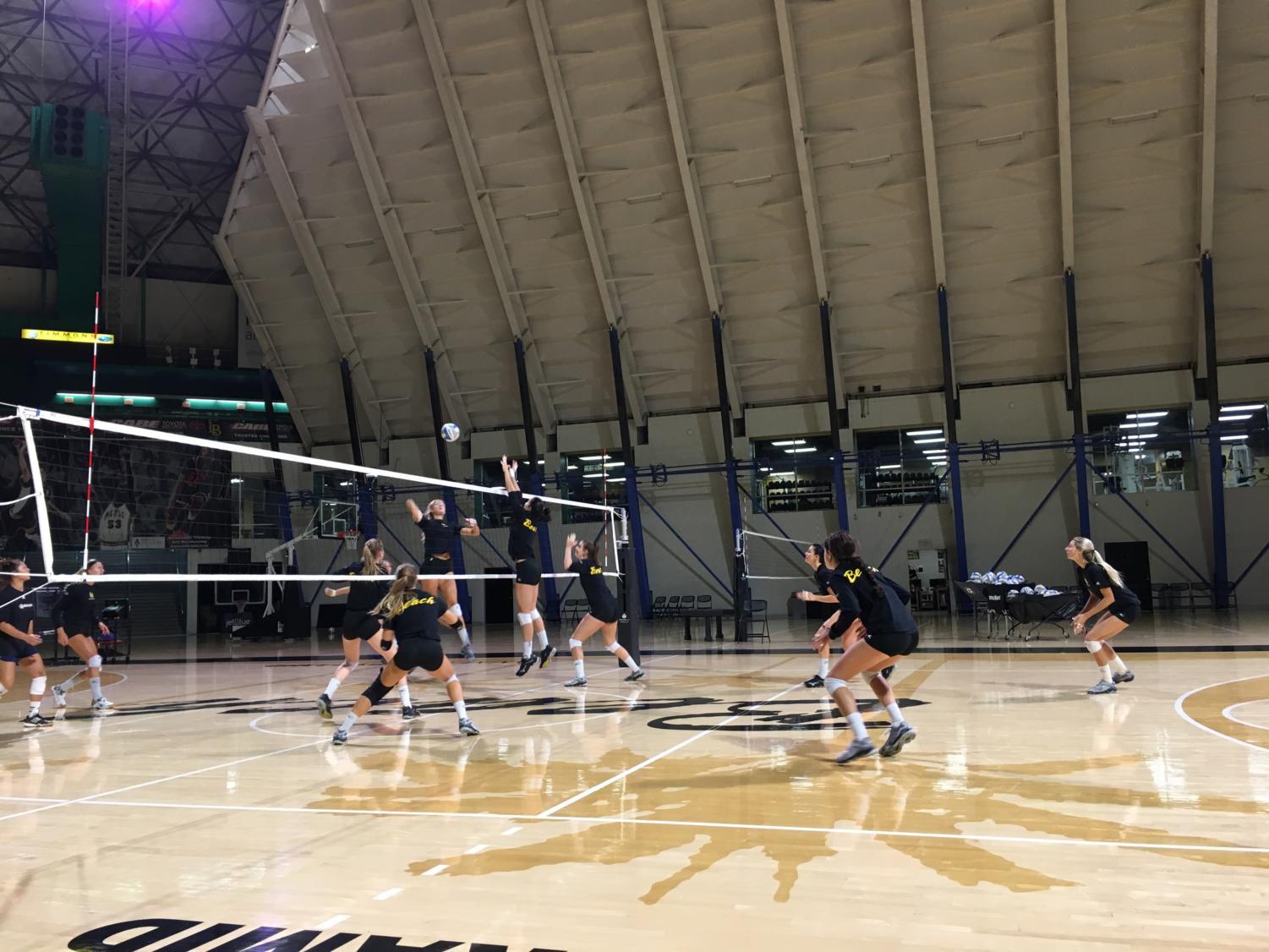 The women's volleyball team scrimmages before its Big West Conference match against UC Davis.