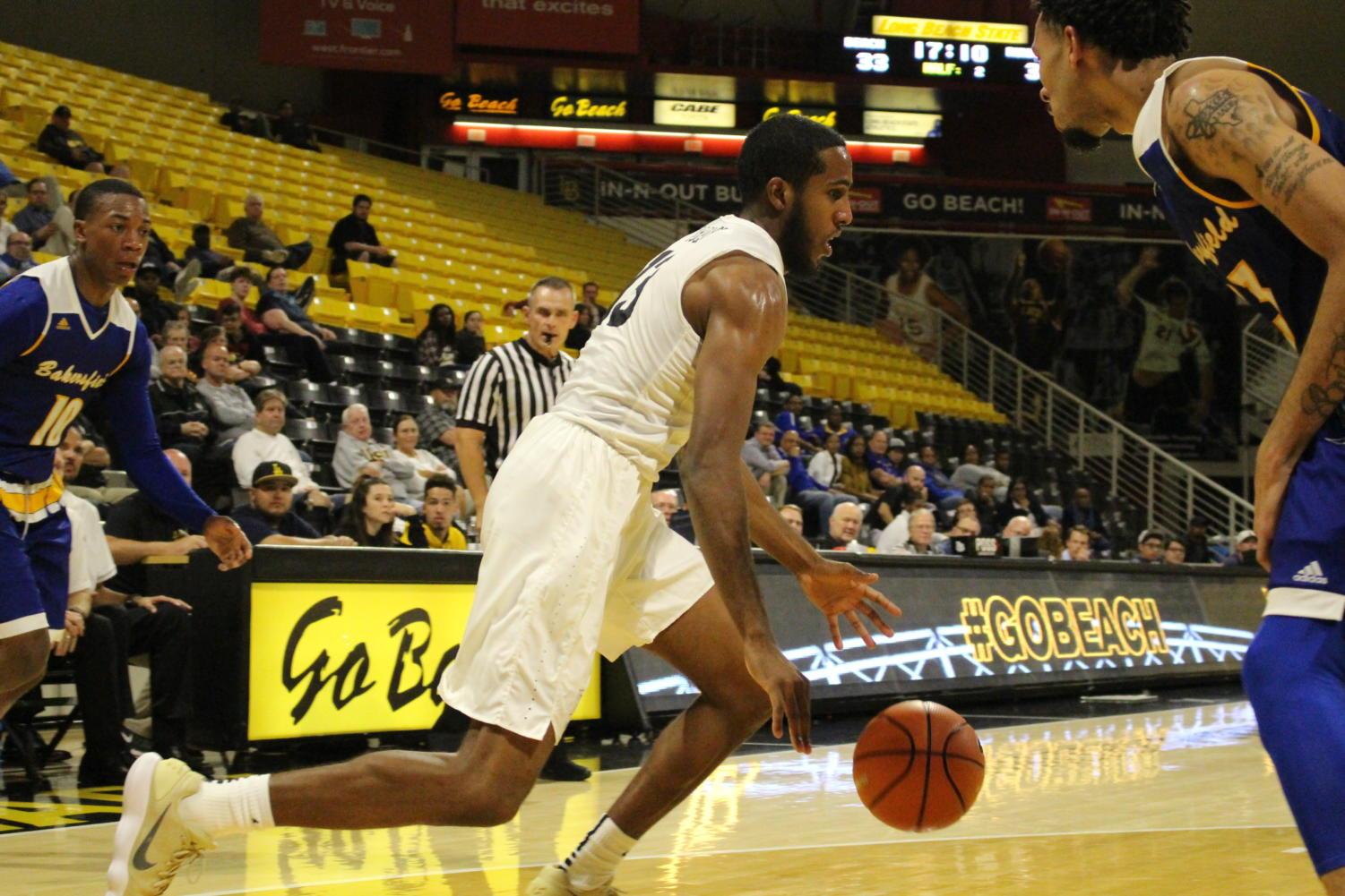Long Beach State senior Barry Ogalue drive in the paint in Monday's game against CSU Bakersfield at the Walter Pyramid.