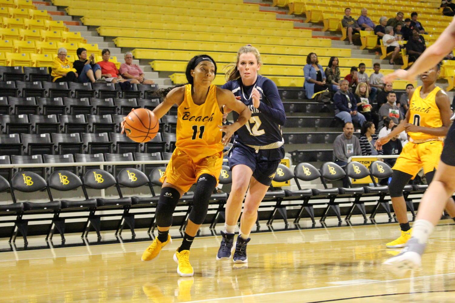Long Beach State junior guard Martina McCowan dribbles the ball in Sunday's game against Montana State in the Walter Pyramid.