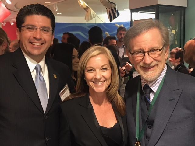 Associate Vice President for Development Kevin Crowe and CSULB spokeswoman Terri Carbaugh pose with Cal State Long Beach alumni Steven Spielberg 12/5.