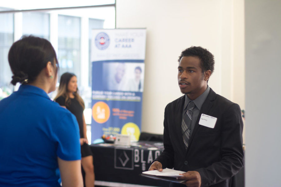 Graduate sociology major Kennedy Collins interview with prospective employers during the Fall Job and Internship Fair.