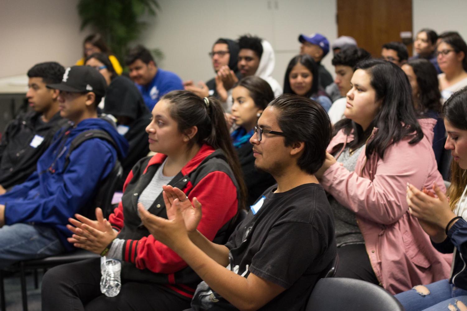 Lynwood High School students applaud guest speakers during the College Bridge: An Ethnic Studies Exchange event in the Anatol Center. The event featured a workshop to help prepare for college.