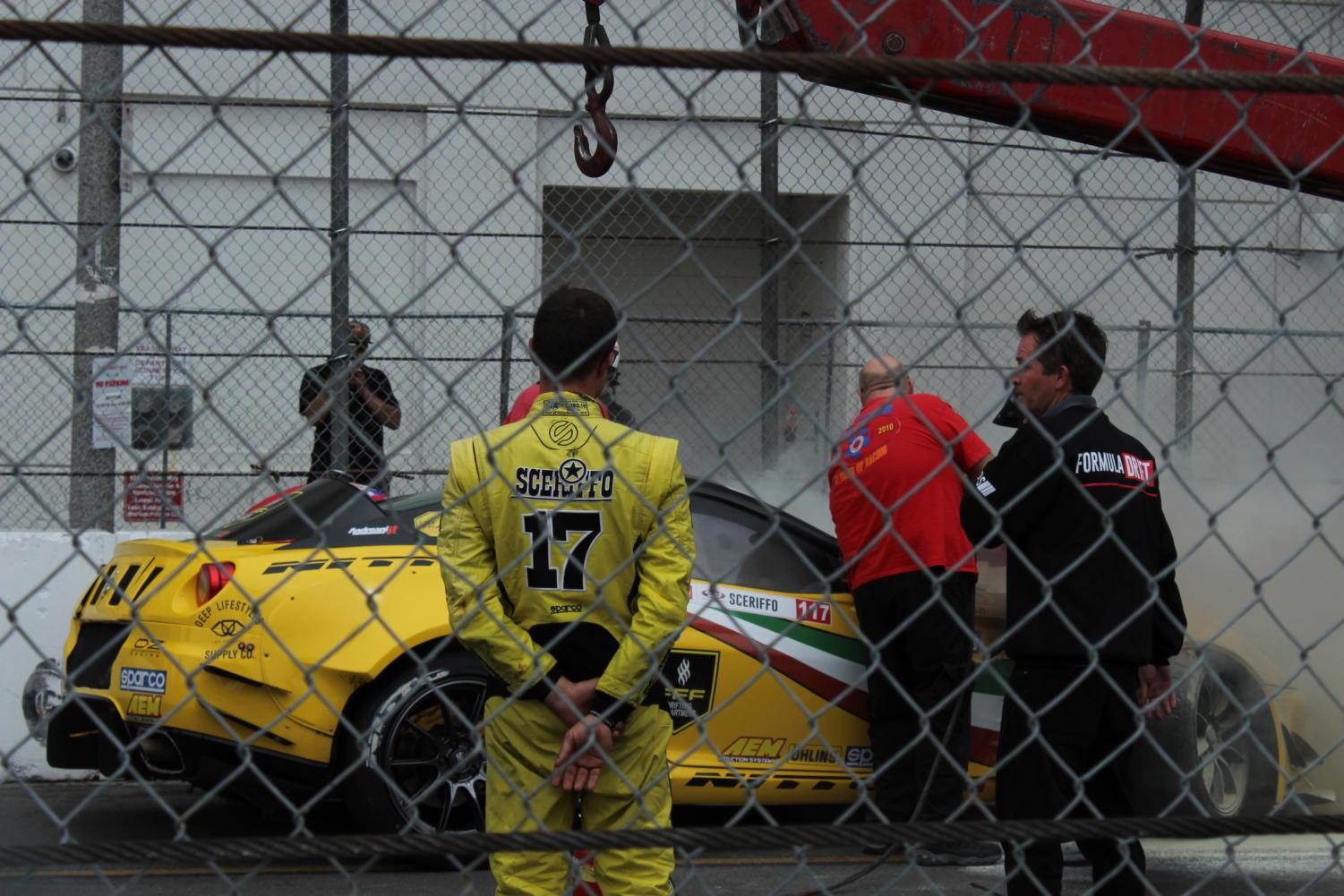 Federico Sceriffo watches as the flames from his Ferrari 599 GTB are extinguished.