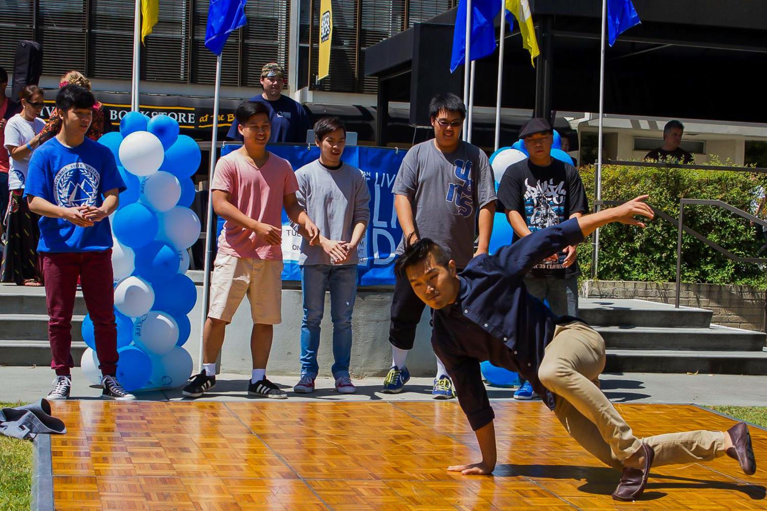 A student breakdances during Project OCEAN’s Live Your Life Day 2015. The event will return to campus April 10 with free massages, support animals and other activities on the Speaker’s Platform lawn from 11 a.m. to 2 p.m.