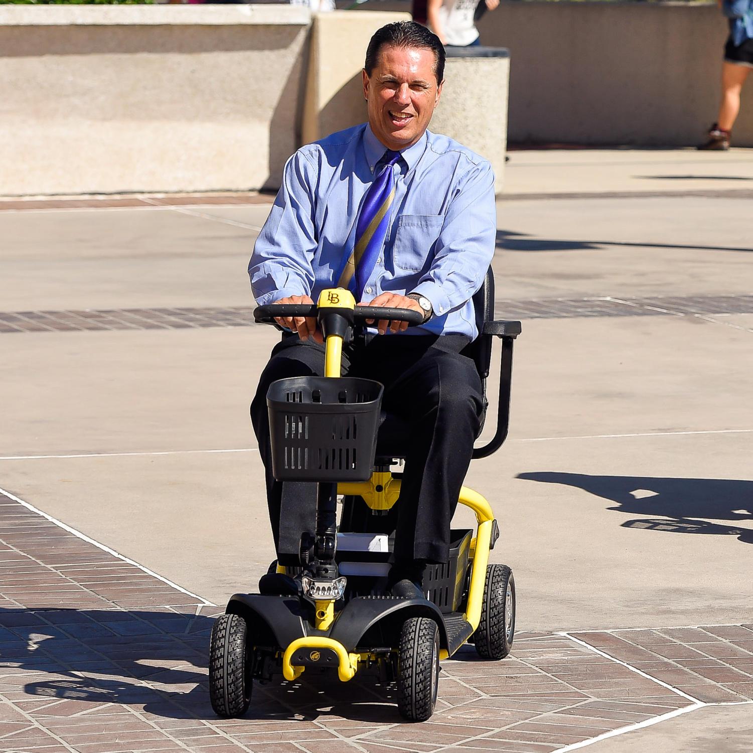 Disabled Student Services Director David Sanfilippo, take's CSULB’s new mobility scooters for a test ride after presenting them to the school in Long Beach, CA on Wednesday, Oct. 21, 2015. CSULB acquired six mobility scooters to check out to students who have temporary disabilities due to injuries, illness or surgery. Two scooters will be used by health services and four will be used by Disabled Student Services.