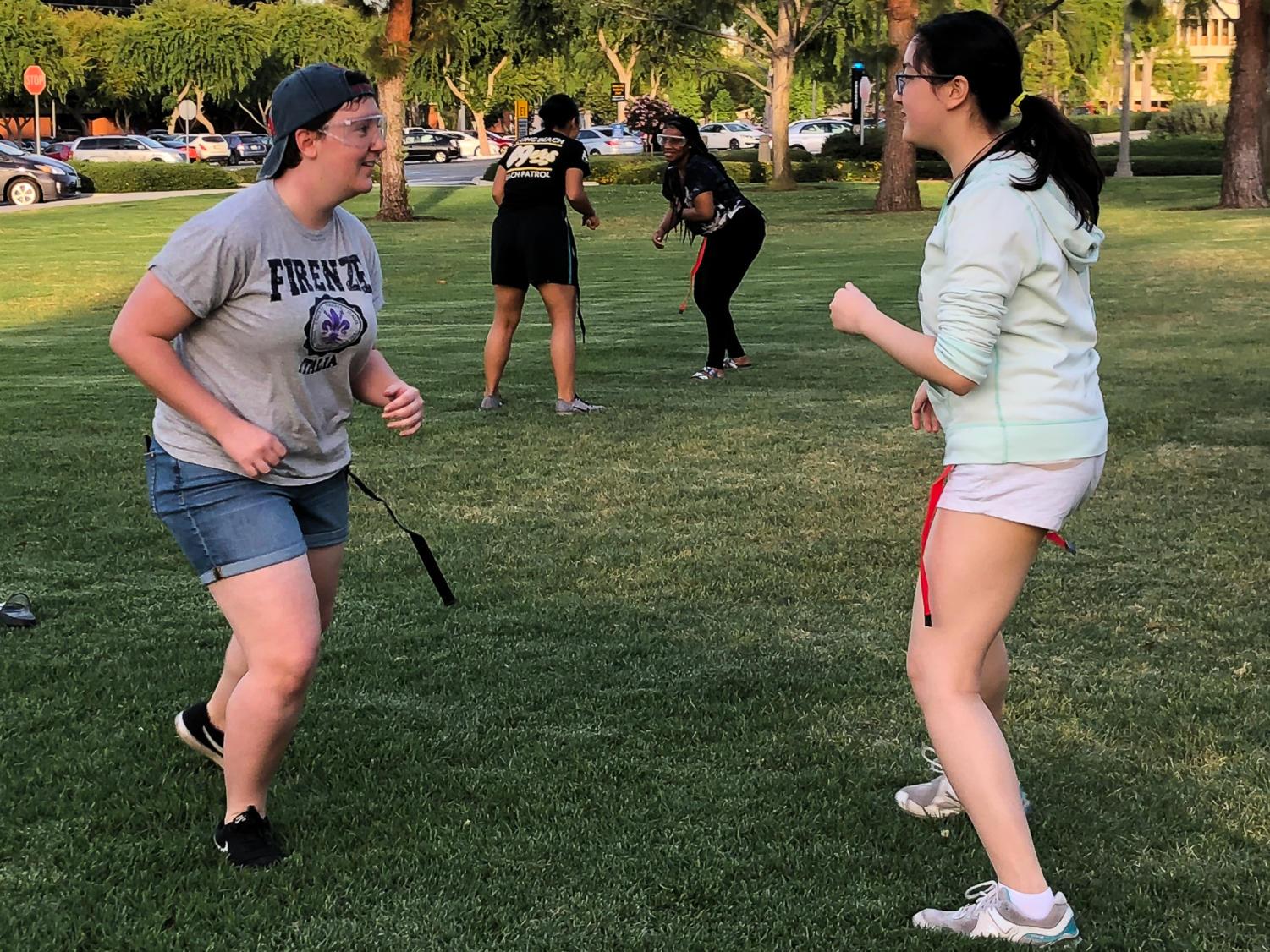 Four students practice self-defense on the Los Alamitos Lawn Tuesday evening. The event was held by the Student Recreation Wellness Center in honor of Sexual Assault Awareness Month.