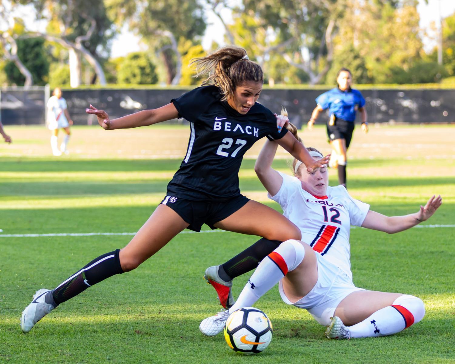Long Beach State sophomore forward Rola Badawiya fights for possession in Sunday's loss against No. 17 Auburn.