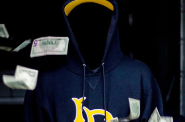Photo contains: A faceless man wearing a Long Beach State sweatshirt with money floating around him.