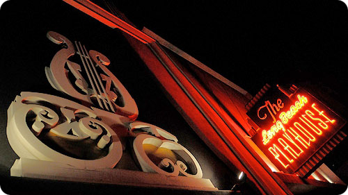Picture Contains: A close up shot of the neon red sign for the Long Beach Playhouse
