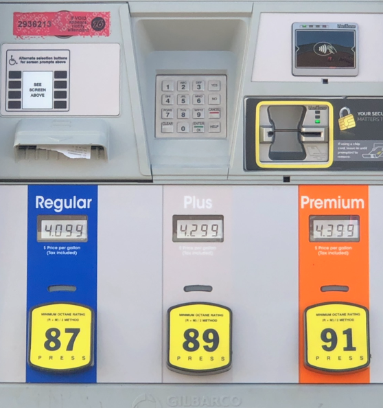 A gas station kiosk displays high gas prices