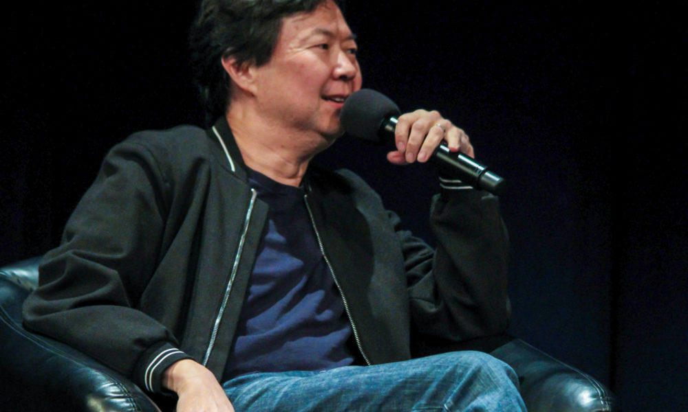 Comedian Ken Jeong Sits in a chair