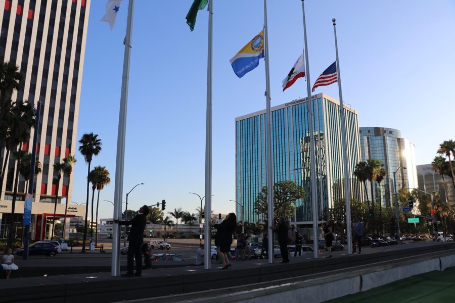 City officials hoist flags