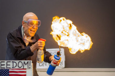 professor performs chemistry experiment with fire