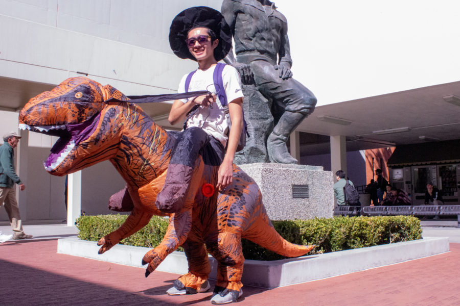 costume of a guy riding a dinosaur