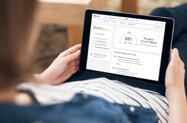 Picture of Experian website displaying a credit score on a laptop.