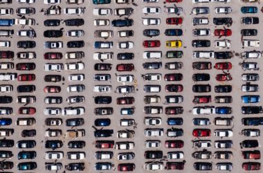 a photo illustration of a whole lot of cars in a parking lot. The point of view is from overhead.