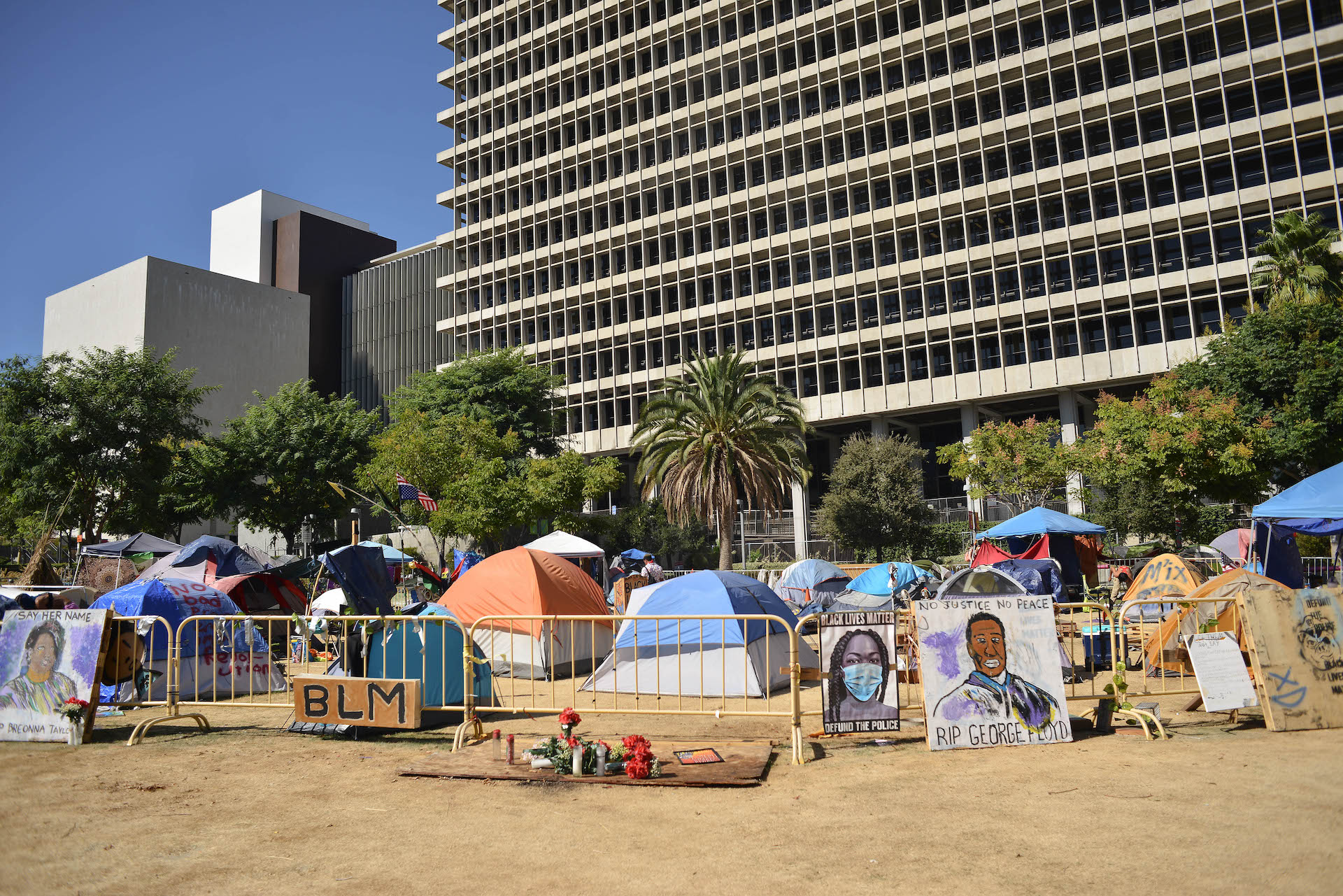 A photo of an encampment in front of L.A. City Hall.