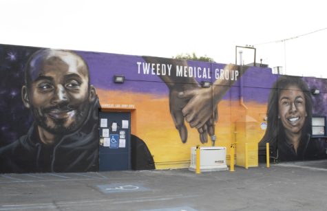 Mural artist Alepsis paints portraits of basketball star Kobe Bryant and daughter Gigi Bryant in honor of their passing last year. Mural can be found on the parking side of Tweedy Medical Group located in South Gate.