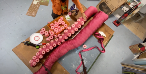 A screenshot from Ashley Steeves&squot; video "Behind the the Scenes - Prop making for Netflix &squot;We watched it all&squot; 2020" where she explains that she used pool noodles as the suckers on the tentacles. Screenshot by Paris Barraza.