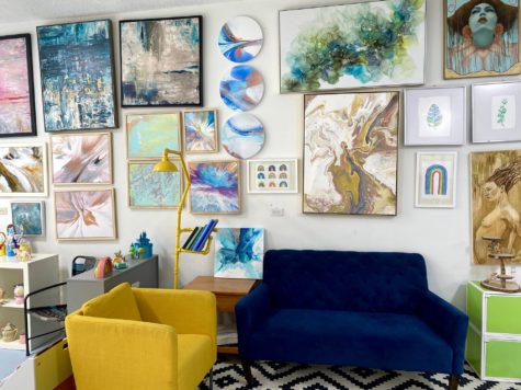 Ashley Steeve's art studio and wall that includes her original paintings. Photo courtesy by Ashley Steeves.