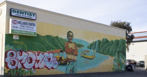 "Golden Boy" is a mural created by Long Beach artist Bodeck Luna Hernandez in 2017 in Cambodia Town.