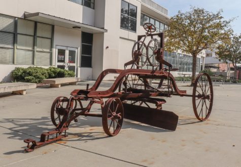 This mysterious sculpture is an old farm equipment similar to a tractor and weirdly nobody knows when or why this was placed on campus.