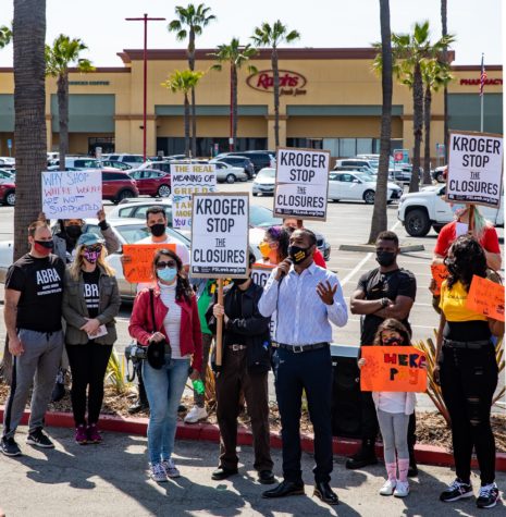 Anthony Bryson addresses the media with other local orgainzers before they march up to the entrance of the Ralph's location on Pacific Coast Highway in Long Beach.