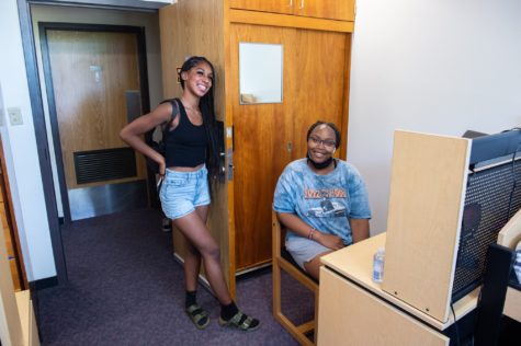 Jasiya Brown, 18, dance major and Grace Gikanga, 18, pre sociology major are settling into their new dorm after Brown's parents helped bring her belongings on Thursday, Aug, 19 for move-in day.