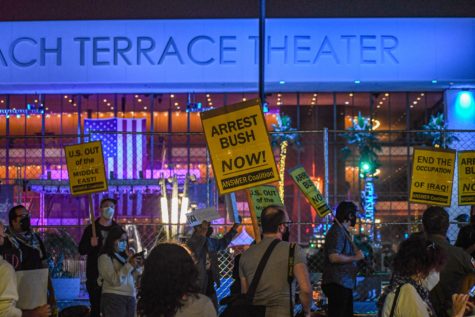 Dozens of protestors gathered outside Long Beach Terrace Theater as they demanded the arrest of former President George W. Bush.