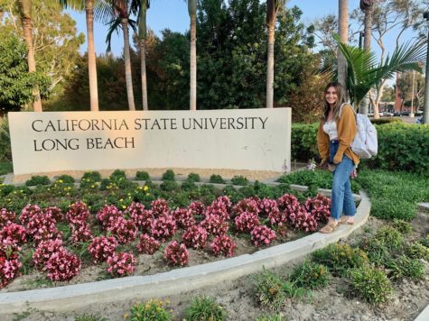 Alvarez posing in front of a CSULB sign. Cal State Long Beach has one of the best social work programs in the entire state.