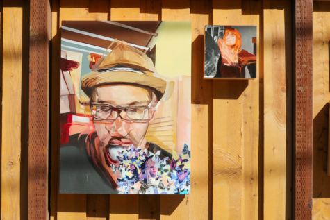 Portrait paintings by Cody Lusby hung in the alley of his home during the Long Beach Open Studio Tour event on Oct. 3 in Long Beach, Calif..