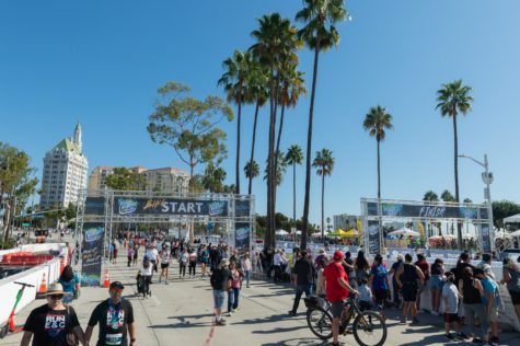 Crowds comprised of family and friends cheer runners as they arrive at the finish line at East Ocean Boulevard during the Long Beach Marathon on Sunday, Oct. 10.