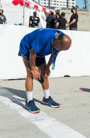 Severino Hernandez, 70, finishes the half-marathon in 3 hours but explains his legs were cramping after mile 10 in Long Beach on Sunday, Oct. 10.