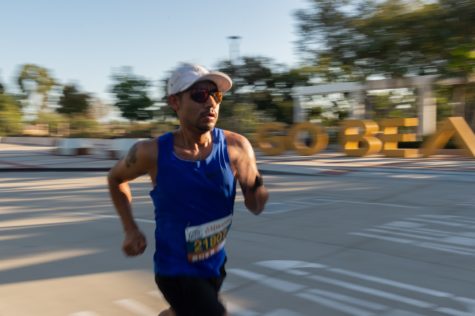 Ivan Garcia, 40, turns towards West Campus Drive on CSULB for the Long Beach Marathon early Sunday, Oct. 10.