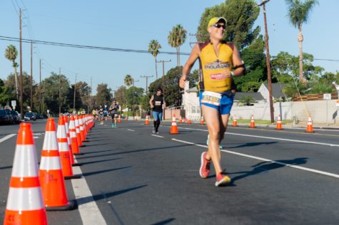 Runners for the Long Beach Marathon arrive at the cross intersection of East Atherton Street and Bellflower Boulevard on Sunday, Oct. 10.