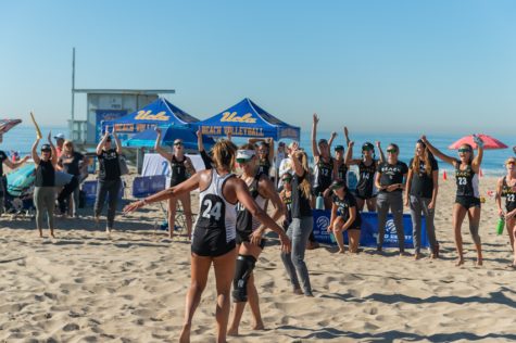 11/14/2021 - Manhattan Beach Pier, CA: Christine Deroos and Sydney Stevens win the match against Cal Poly during the SoCal Challenge NCAA women's beach volleyball weekend event on Sunday.