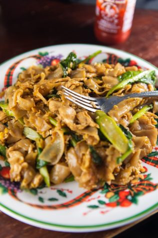 Pad-see-ew is a famous Thai street style dish known for its fast cooking rate and charred, chewy flat rice noodles, great for students who want to eat a quick bite.
