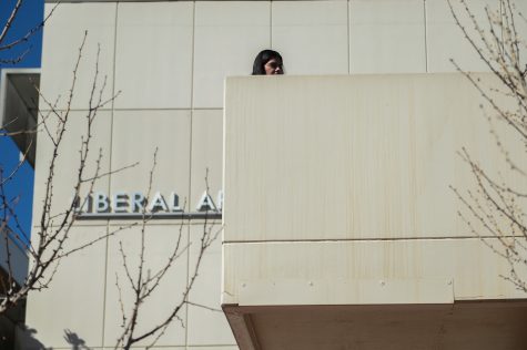 A student standing near the Liberal Arts building on the first day of students back on-campus on Feb. 7.