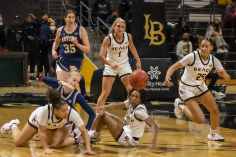 LBSU players looking to get the ball back after UCI knocked it out