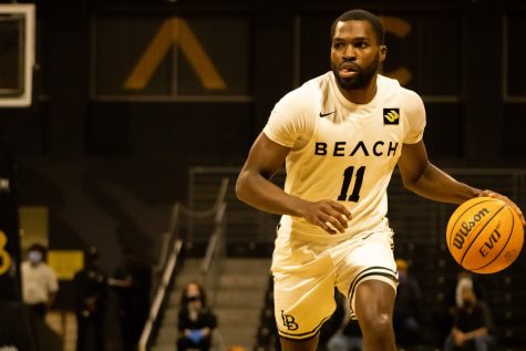 02/24/2022: Long Beach, CA- CSULB Point Guard Joel Murray dribbles down the court during the home game against UC San Diego on Thursday.