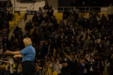 02/25/2022: Long Beach, CA- Fans in the CSULB student section celebrate after the CSULB Men's Volleyball team is awarded with the point against Stanford University on Friday in The Pyramid. Photograph by: Sonny Tapia