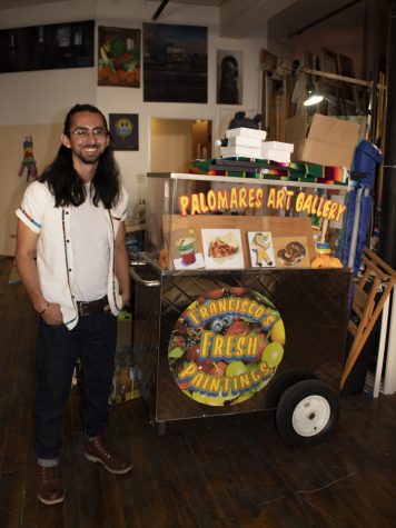 L.A. Based painter Franciso Palomares next to the refurbished fruit care he sold his painting out of.