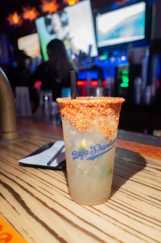 One of Panama Joe's popular drinks is the Tajin rimmed cup filled with tequila, lemon juice, and cucumber slices that cost $15 in Long Beach on Thursdays.