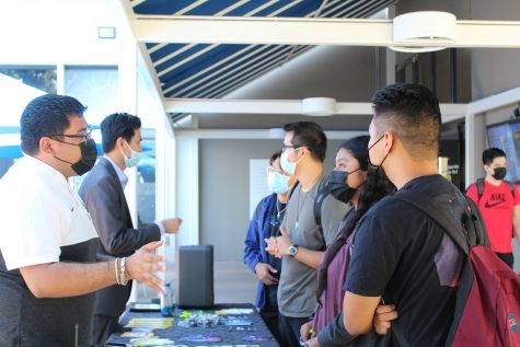 ASI executives speak with students and invite them to future events.