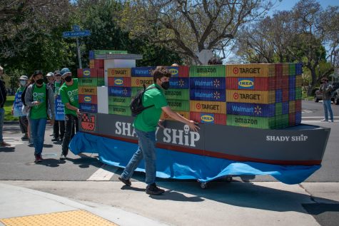 Environmental activist march with their "Shady Ship" float to Target on Earth Day as a protest towards overseas shipping pollution.